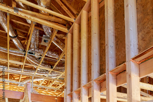 Whole house air ventilation and cleaning system in silver insulation material on the attic
