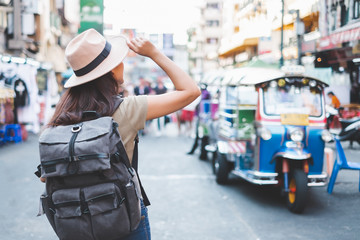 Asian traveler/tourist walking and travelling in Khao San rd. walk street, Bangkok, Thailand