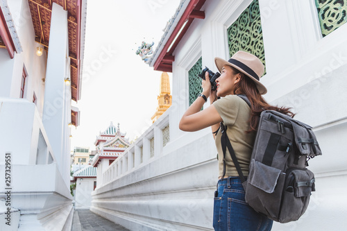 Photography Asian woman travel Bangkok, Thailand, in beautiful temple during summer season,