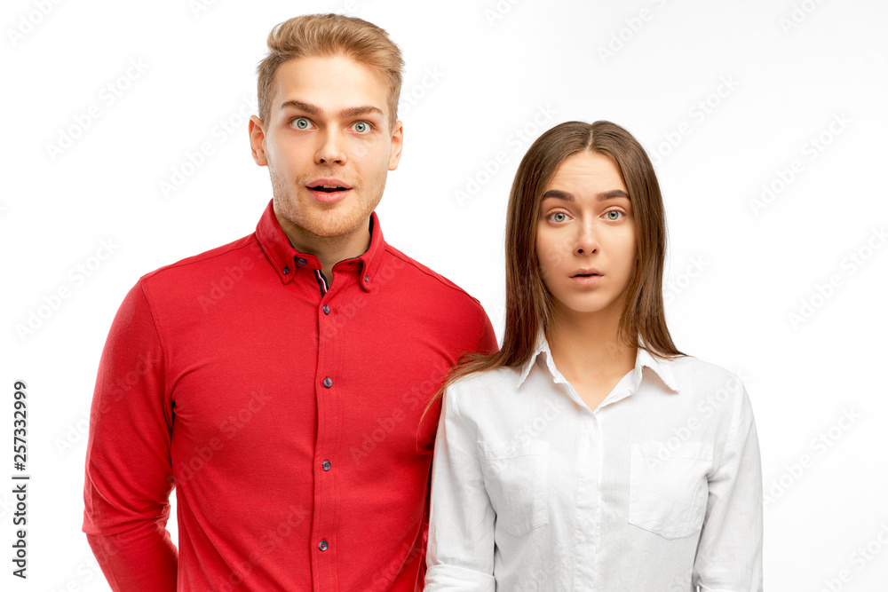 Surprised European partners, shows empathy, amazed by terrible news or revelation, impressed with something, isolated white background in studio Surprised European partners, shows empathy, amazed by terrible news or revelation, impressed with something, isolated white background in studio