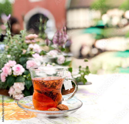 English style afternoon hot herbal tea with cookies at the backyard garden