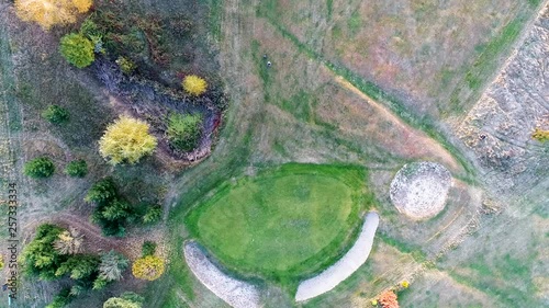 Top view of a golf player around the putting area. photo