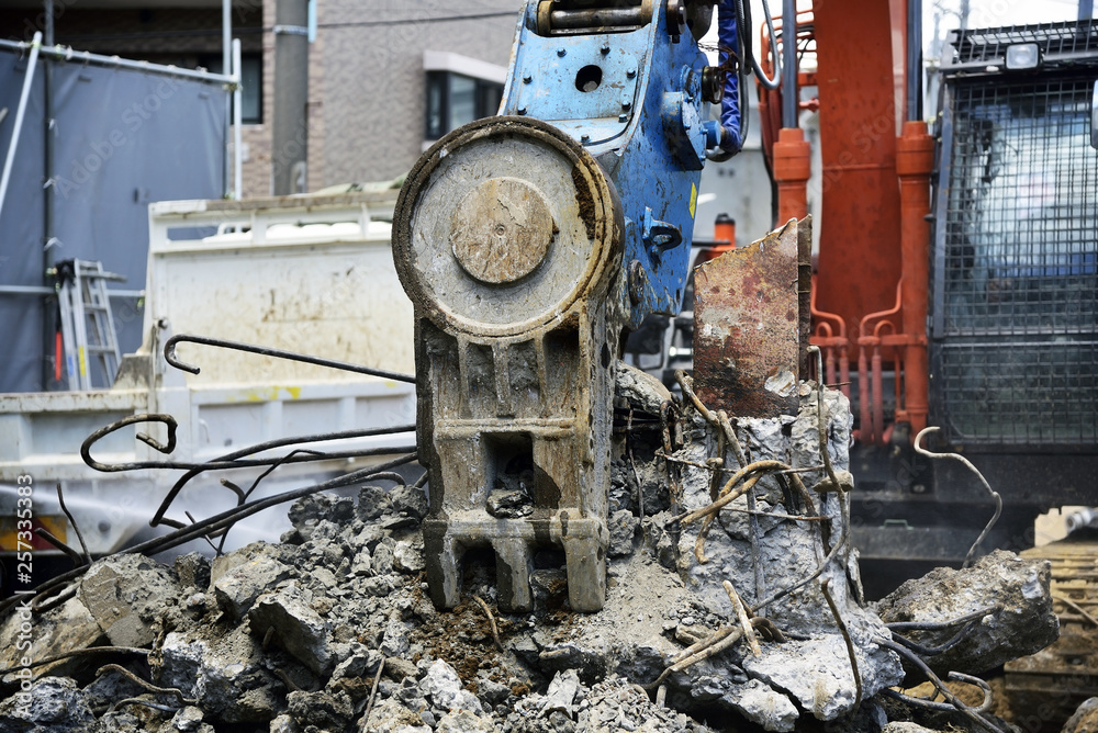 Demolition site: Demolition construction equipment breaks up concrete