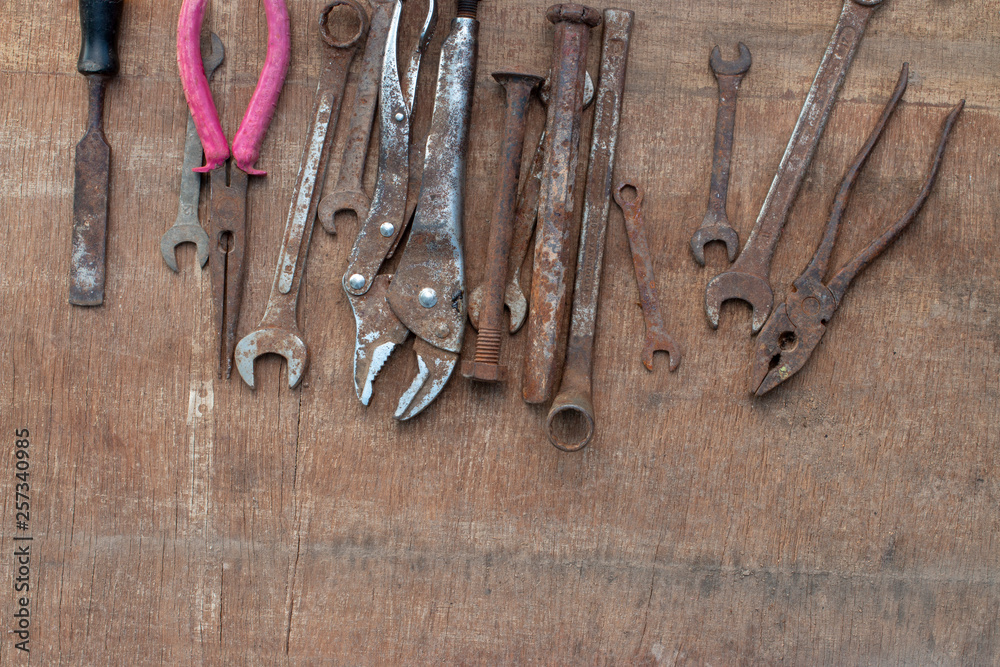 old tools on wooden background old tools on wooden background