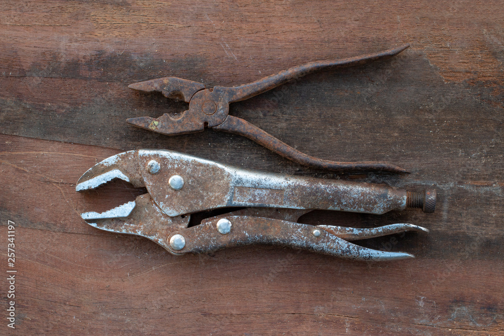 old tools on wooden background old tools on wooden background