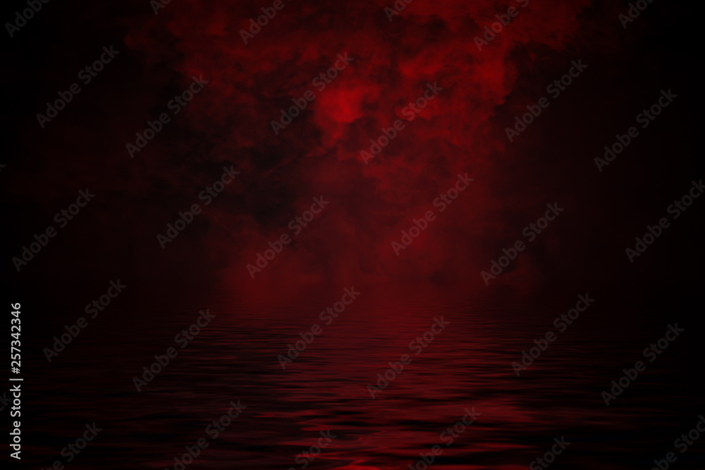 Fototapeta premium Coastal fog . Red smoke on the shore . Water reflection .