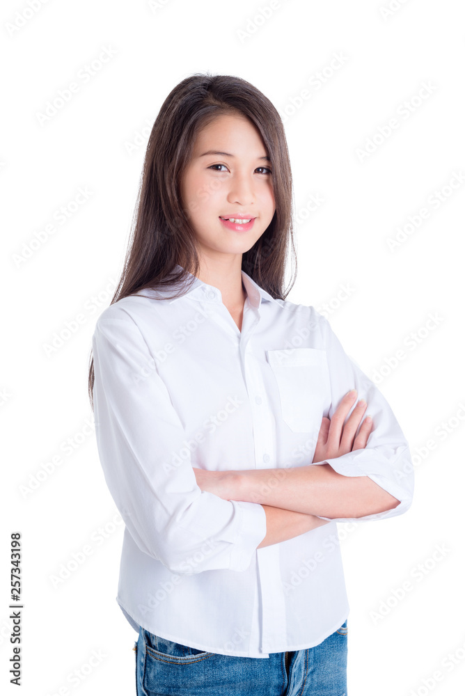 Pretty asian female teenager standing and smiling over white background Pretty asian female teenager standing and smiling over white background