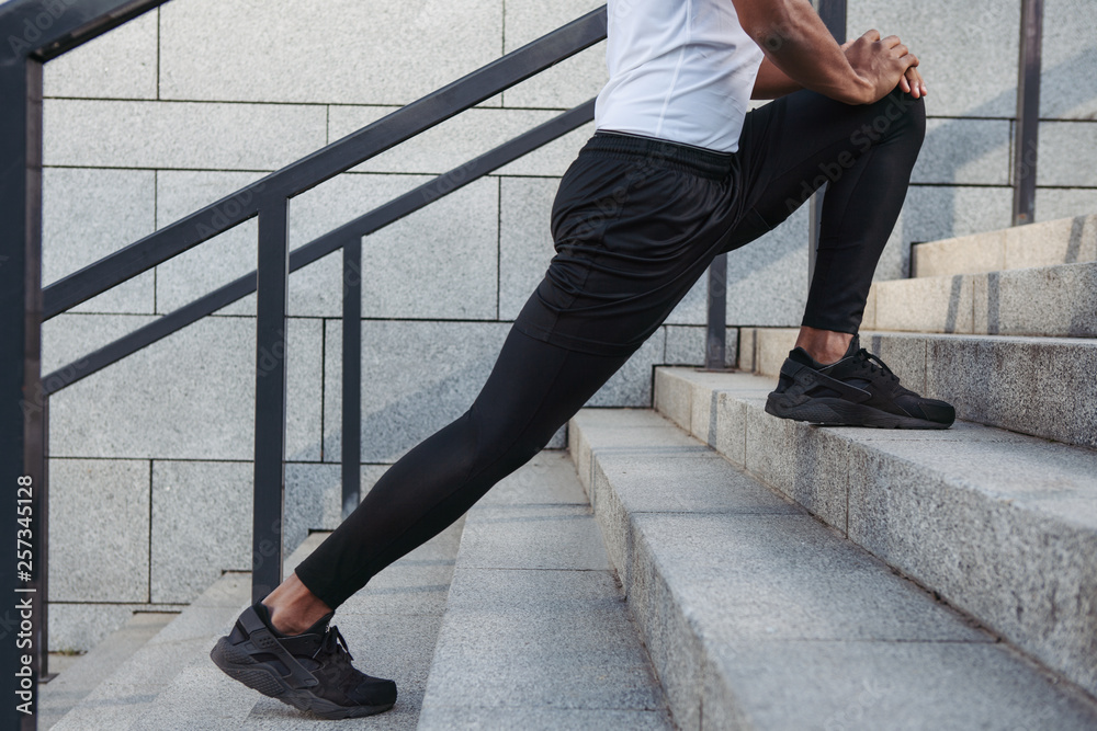 Close up of legs stretching.