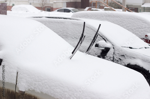 фотографія Snowy season. The car is a completely covered snow.