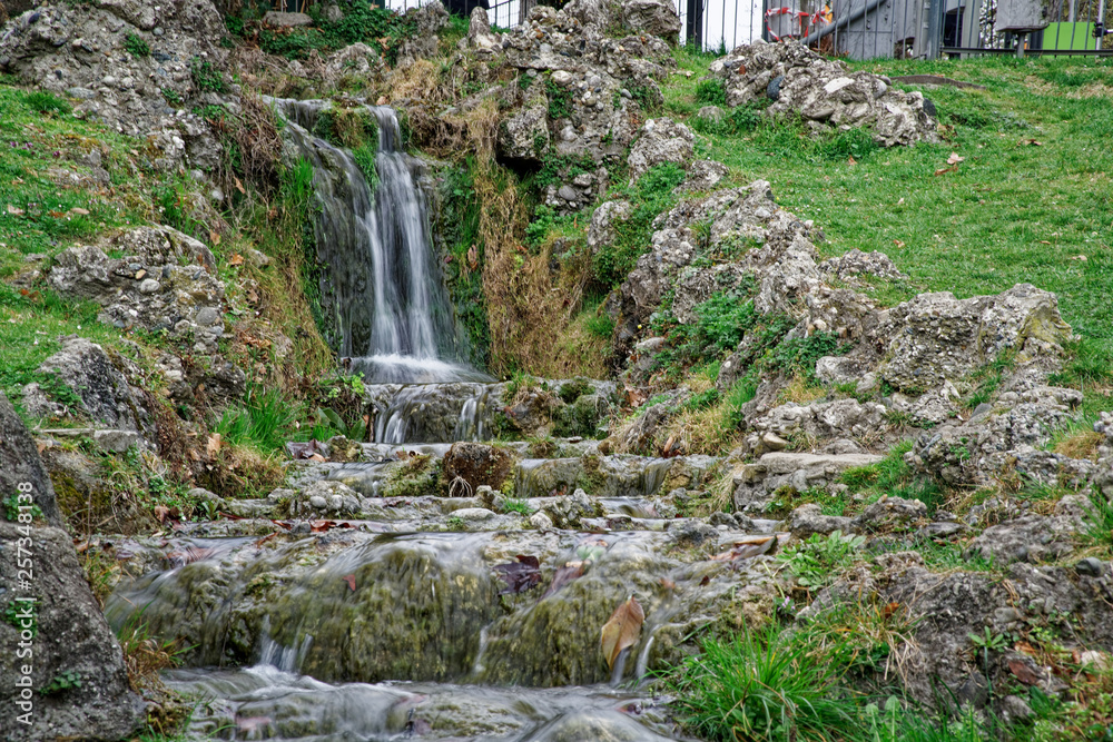 Flowing water stream, water drops and reflection Flowing water stream, water drops and reflection