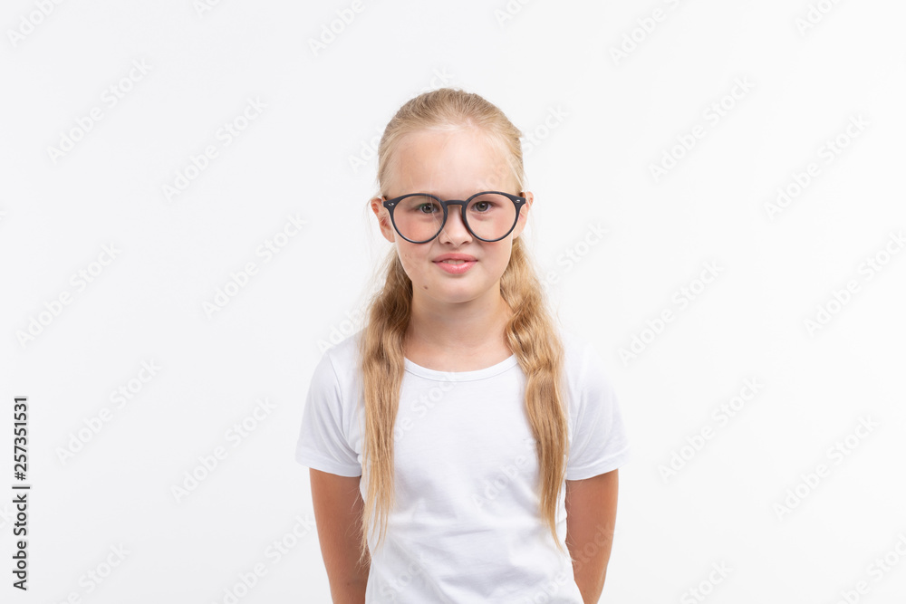 Beautiful child girl with glasses isolated on white Beautiful child girl with glasses isolated on white