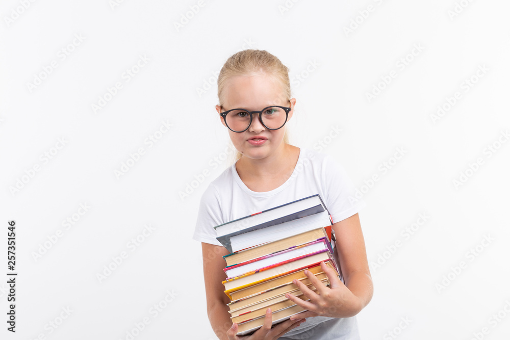 education, people, children and school concept - School student in goggles holding books in hands on white background education, people, children and school concept - School student in goggles holding books in hands on white background