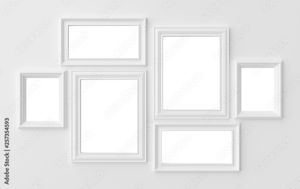 White photo frames on white wall with shadows