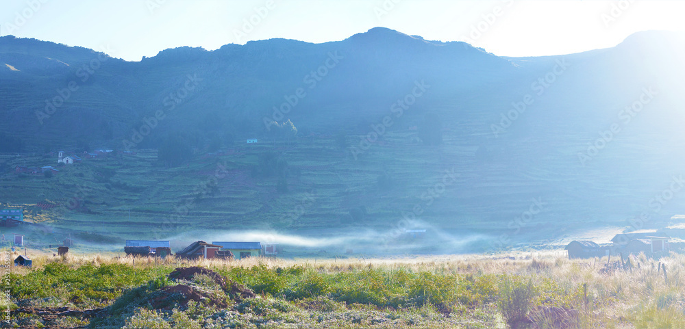 Panoramic photo of rural landscape. Sunrise. Bright and foggy.  