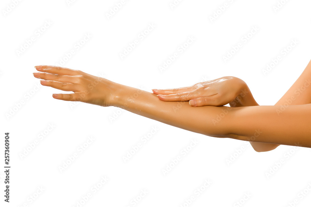 closeup of female hands applying hand cream on white background closeup of female hands applying hand cream on white background