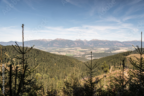Zapadne Tatry and wetsrnmost part of Vysoke Tatry mountain range from hiking trail bellow Slema hill in Nizke Tatry mountains in Slovakia photo