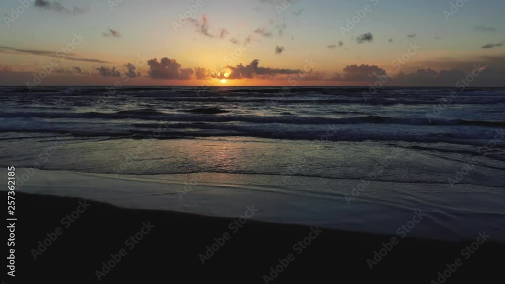 Blazing colors of sunset beach, rhythmically beaten by Pacific Ocean Waves. Natural golden saturation. Drone based aerial footage. Cinematic and beautiful. calming and Relaxed Euphoric camping Blazing colors of sunset beach, rhythmically beaten by Pacific Ocean Waves. Natural golden saturation. Drone based aerial footage. Cinematic and beautiful. calming and Relaxed Euphoric camping