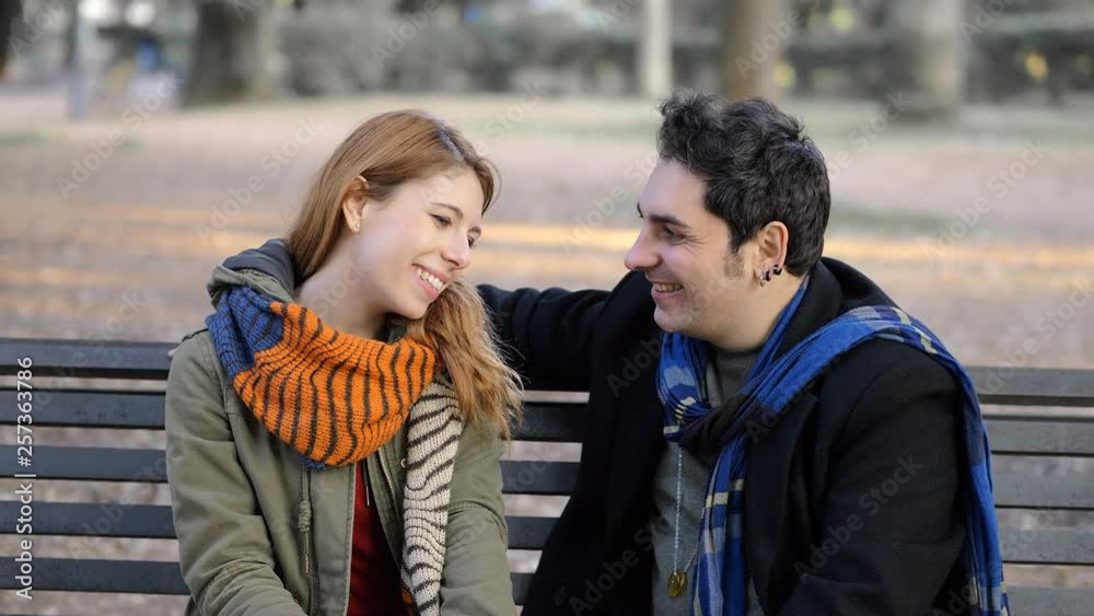 portrait of young woman refusing the courtship of a man at the park.embarrassment, rejection portrait of young woman refusing the courtship of a man at the park.embarrassment, rejection