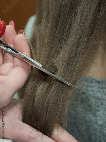 The technique of cutting with scissors. Close-up.