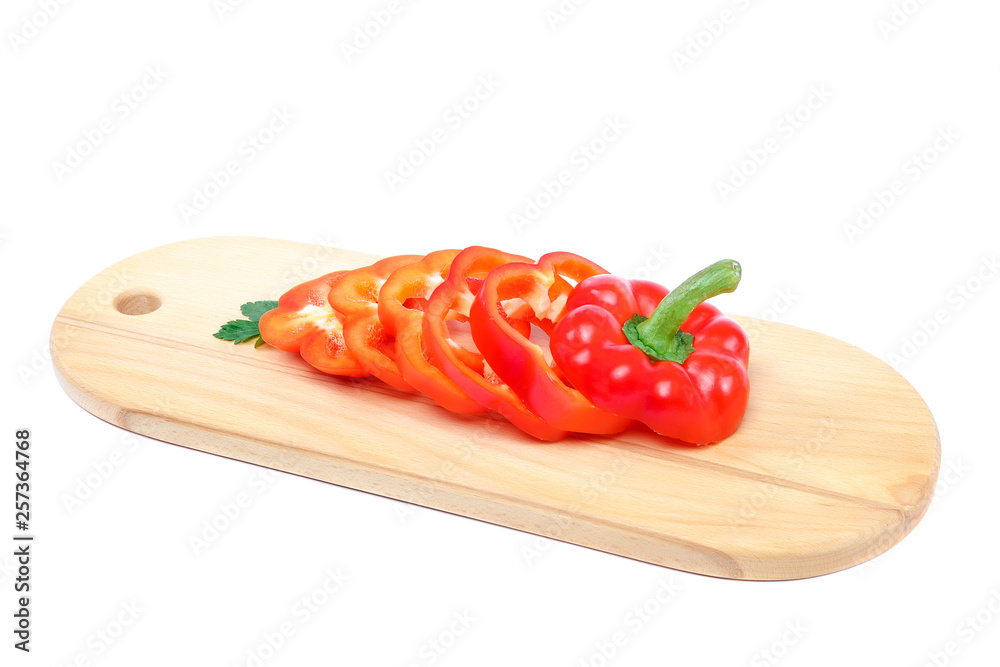 Slices of sweet pepper on a cutting wooden board. Slices of sweet pepper on a cutting wooden board.