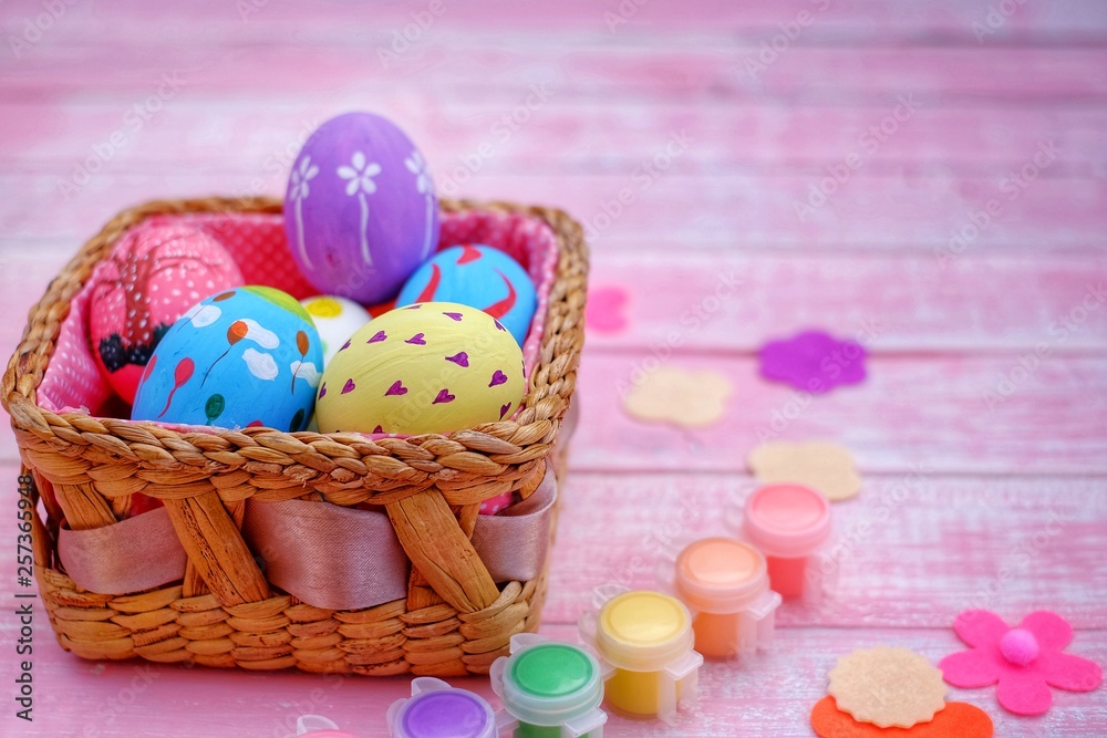 Colorful hand painted easter eggs with pink distress wooden background, pastel color eggs, each with a unique pattern. Colorful hand painted easter eggs with pink distress wooden background, pastel color eggs, each with a unique pattern.