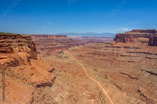 Road to the canyon. Desert road in Canyonlands National Park, Utah USA
