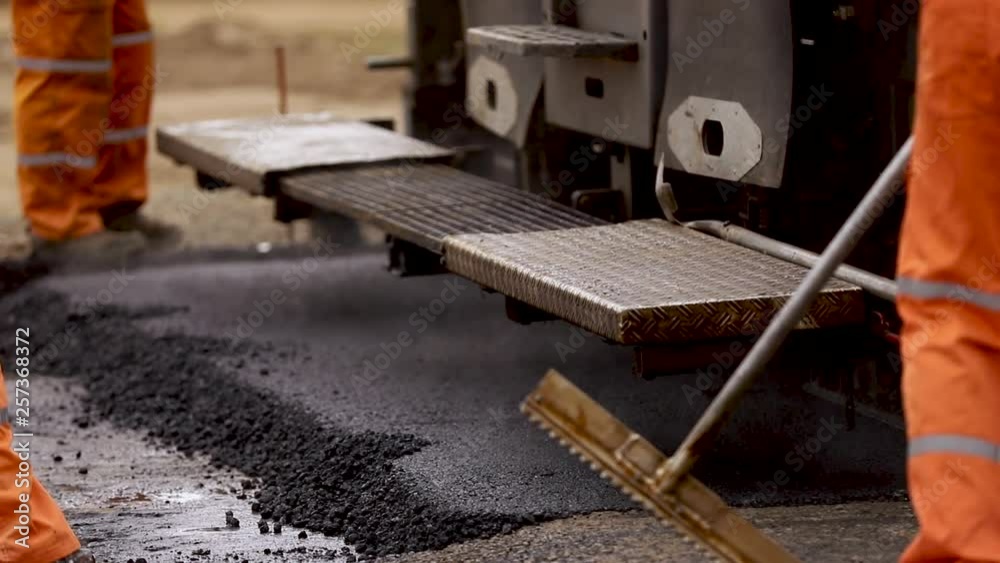 Trimming new rad. Asphalt on the road. Bitumen Trimming new rad. Asphalt on the road. Bitumen