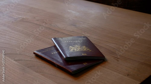 2 passports putting on table slowly photo