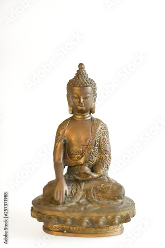 Copper Buddha on a white background