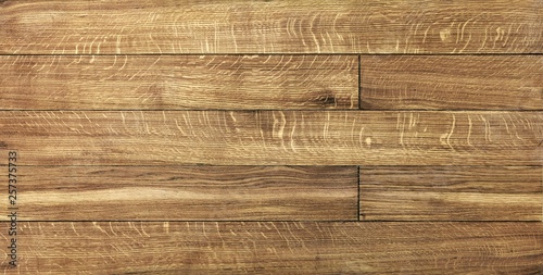 parquet from solid wood. sample of parquet. texture or background. wood texture. board. painted with natural oil. wax. mastic. imitation of valuable species of wood.