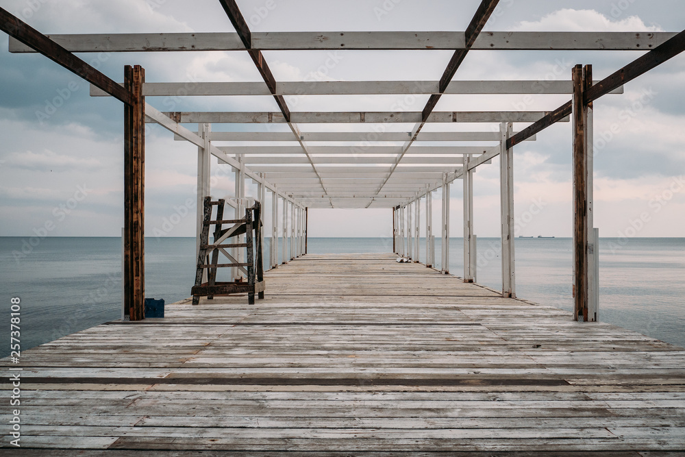 Wooden pier and sea, perspective, corridor view with no people Wooden pier and sea, perspective, corridor view with no people