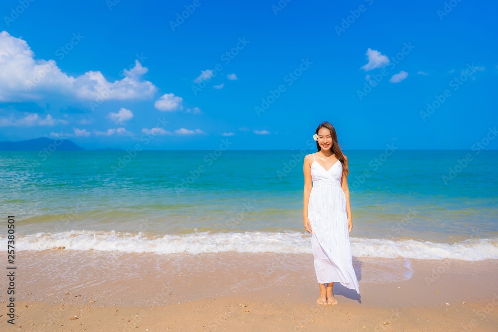 Portrait beautiful young asian woman happy smile leisure on the beach sea and ocean Portrait beautiful young asian woman happy smile leisure on the beach sea and ocean