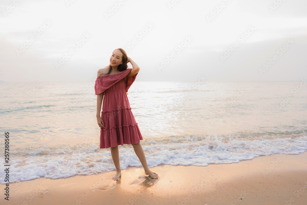 Portrait beautiful young asian woman happy smile leisure on the beach sea and ocean Portrait beautiful young asian woman happy smile leisure on the beach sea and ocean