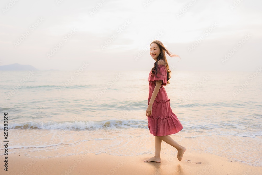Portrait beautiful young asian woman happy smile leisure on the beach sea and ocean Portrait beautiful young asian woman happy smile leisure on the beach sea and ocean