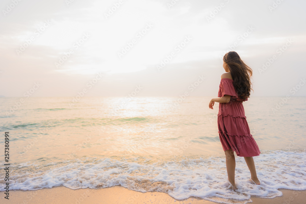 Portrait beautiful young asian woman happy smile leisure on the beach sea and ocean Portrait beautiful young asian woman happy smile leisure on the beach sea and ocean