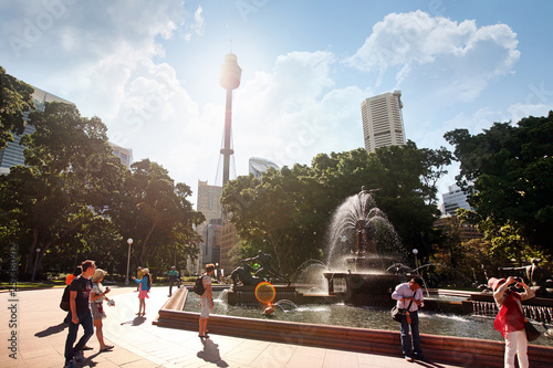 Photography SYDNEY, AUSTRALIA November 20, 2017: Hyde Park Daytime Archibald fountain water reflection trees, sunbeams at Sydney TV Tower
