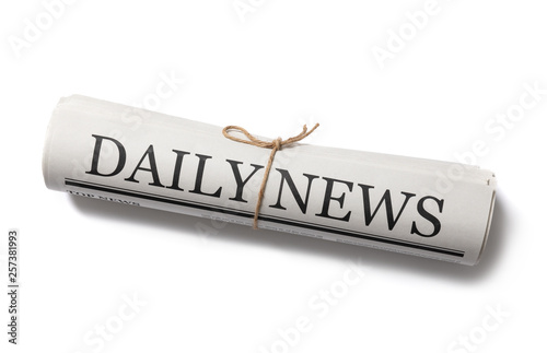Fényképezés Rolled Business Newspaper with the headline News isolated on white background, D