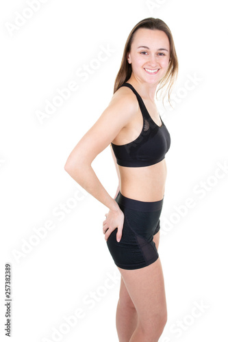 Young woman doing stretching exercise at home fitness studio