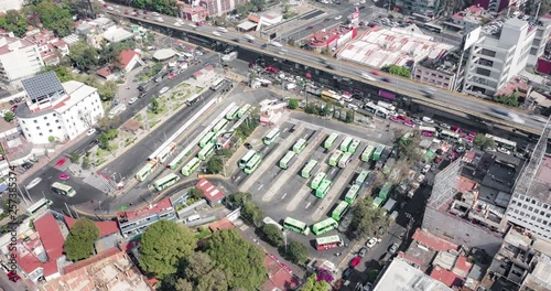 Aerial orbit hyeprlapse of the big bus stop of Mixcoac in Mexico City photo