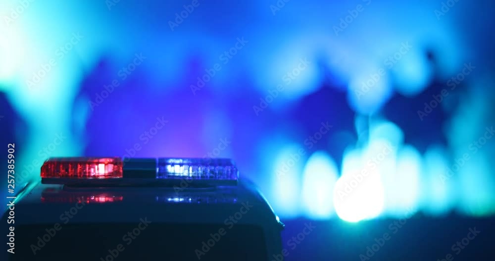 Police cars at night. Police car chasing a car at night with fog background. 911 Emergency response police car speeding to scene of crime. Selective focus Police cars at night. Police car chasing a car at night with fog background. 911 Emergency response police car speeding to scene of crime. Selective focus
