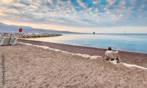 Relaxing morning on central public beach in Eilat - famous tourist resort and...