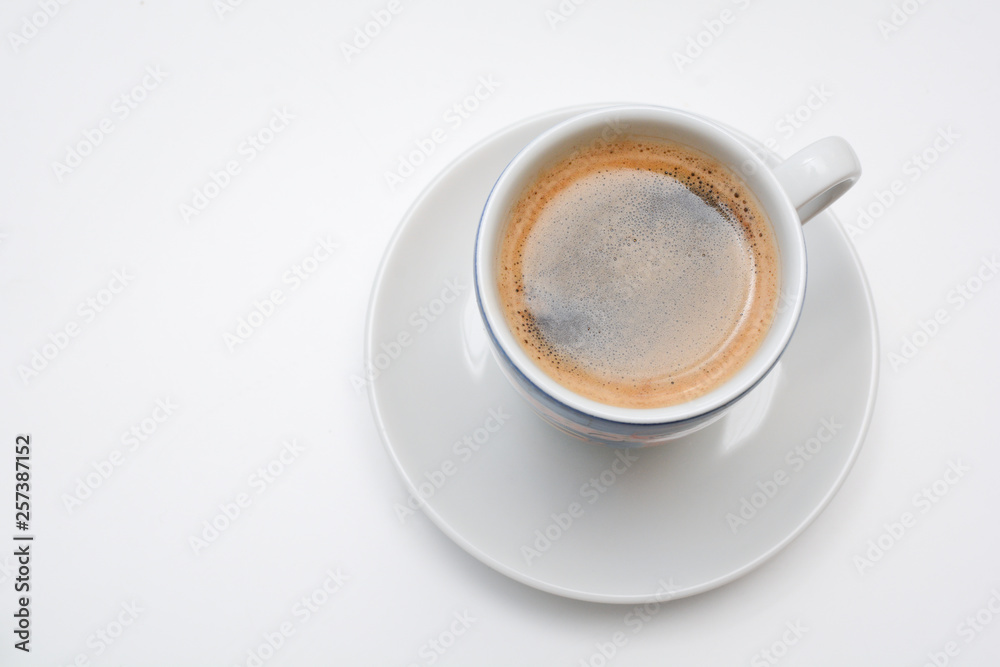 Strong espresso served in white cup and saucer Strong espresso served in white cup and saucer