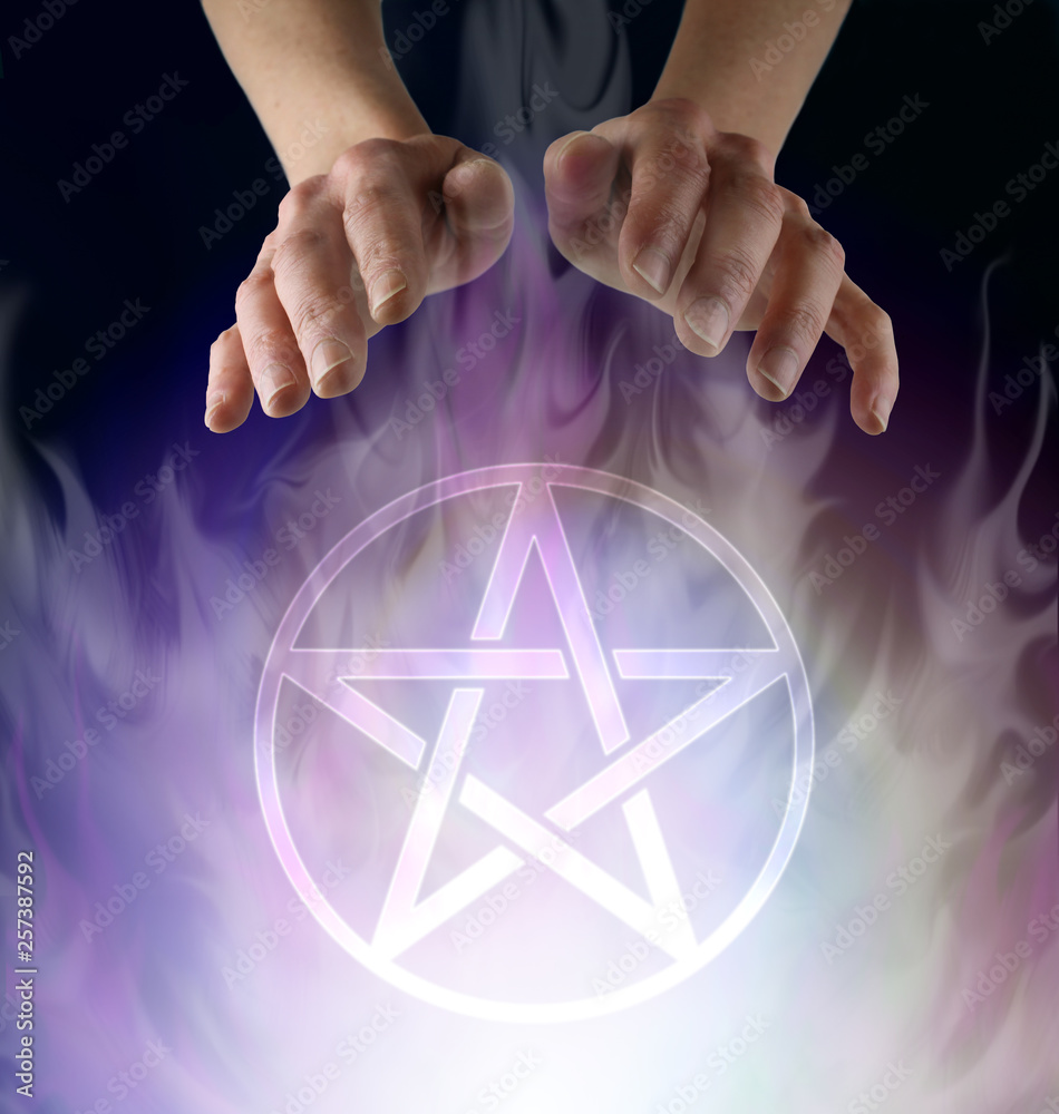 witch's hands hovering above a transparent Pentacle symbol ...