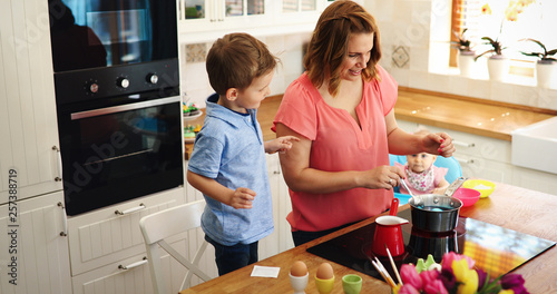 Mother and son paint Easter eggs