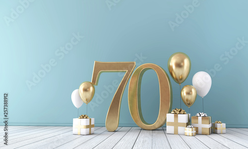 Number 70 party celebration room with gold and white balloons and gift boxes. 