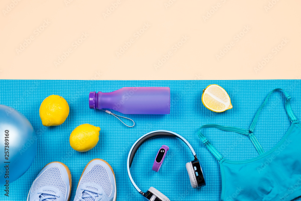 Fitness equipment. Woman workout accessories and clothes flat lay. Top view, fitness background Fitness equipment. Woman workout accessories and clothes flat lay. Top view, fitness background
