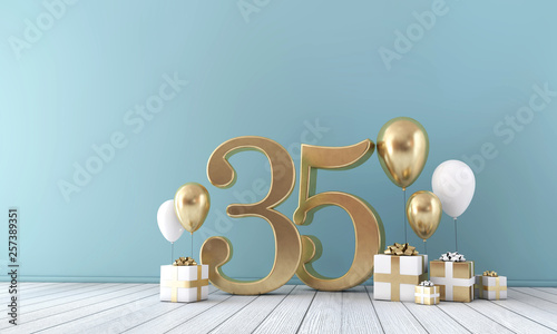 Number 35 party celebration room with gold and white balloons and gift boxes.  photo