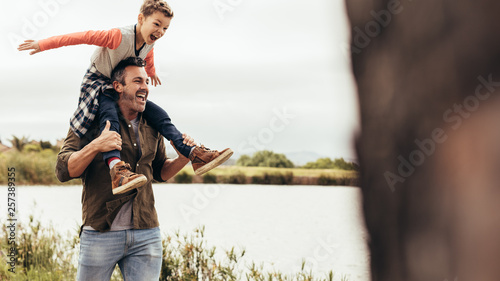 Bild auf Leinwand Father and son enjoying outdoors