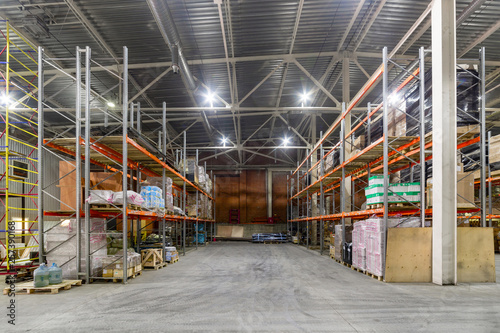 Long shelves with a variety of boxes and containers.