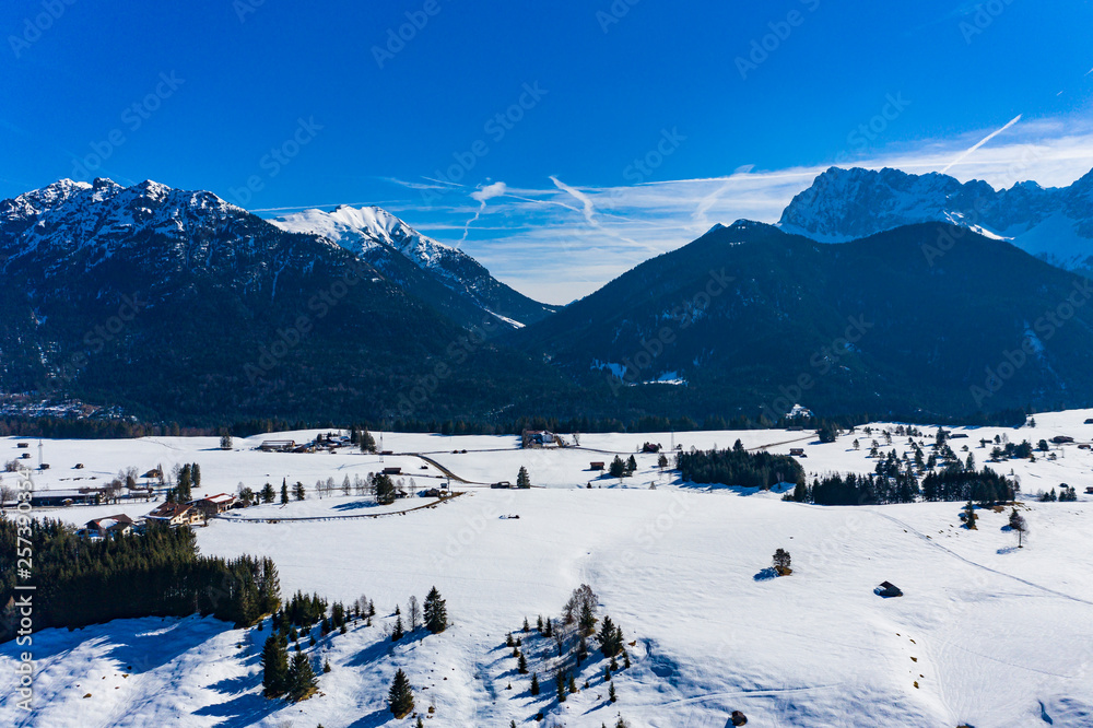 Aerial view, Mittenwald snowy meadow, Alps and Karwendel mountains, Bavaria, Germany